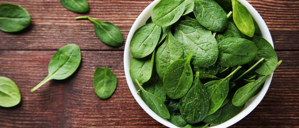 Spinach in a bowl and across the table